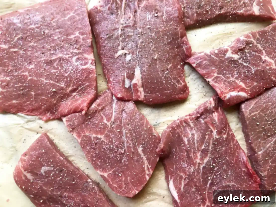 Searing flat iron steak in a Dutch oven for braised beef stew