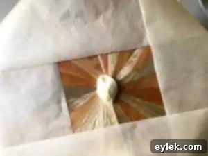 Dab of icing on cake plate