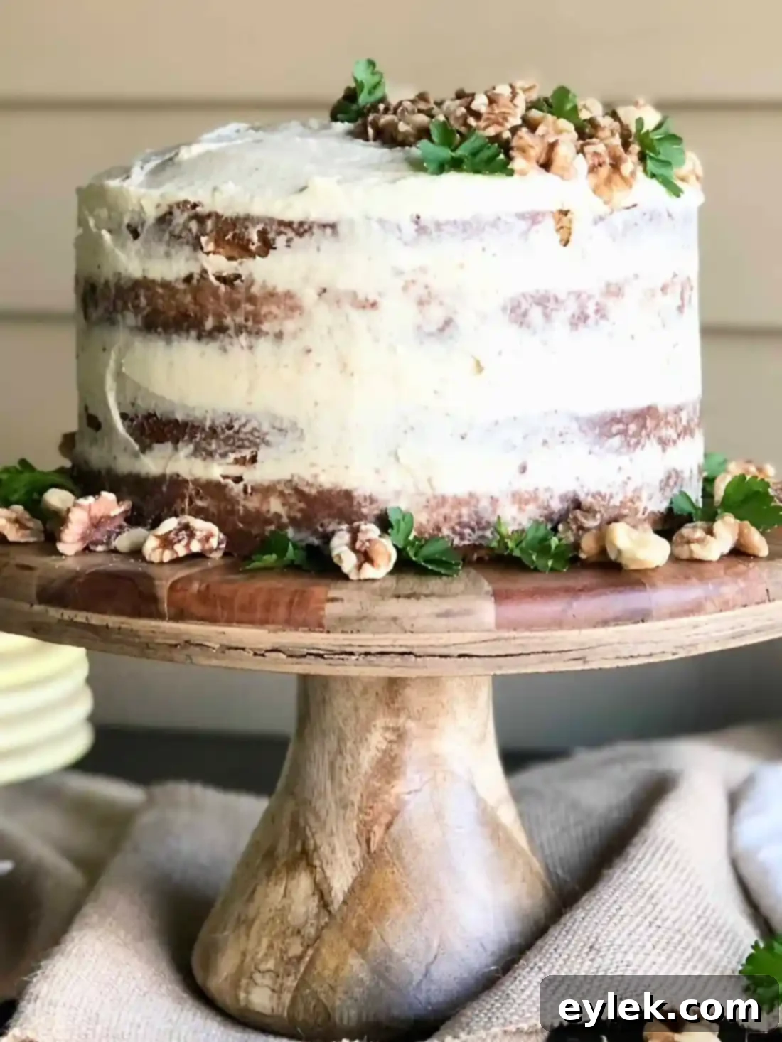Julia's Walnut Cake with French Butter Icing on a cake stand