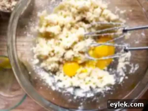 Cake batter poured into pans