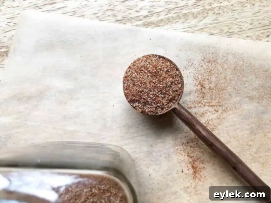 Ingredients for homemade taco seasoning on a wooden board