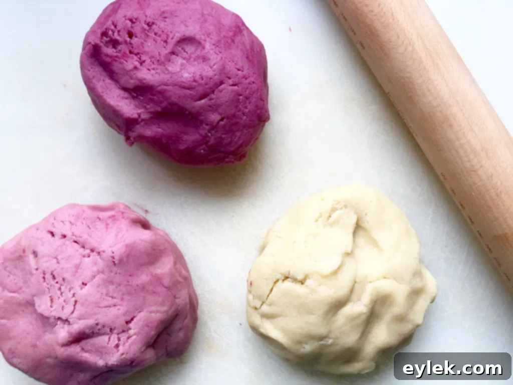 Rolling out different colored cookie dough