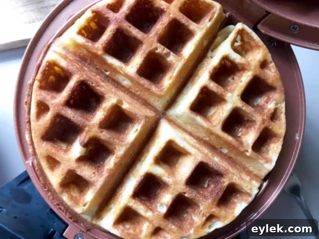 Gluten-Free (Or Not) Classic Belgian Waffles: Waffle iron cooking waffles.