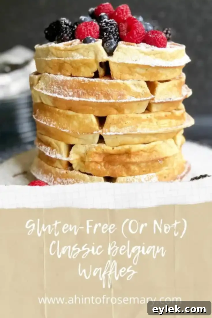 Gluten-Free (Or Not) Classic Belgian Waffles: Artful stack of waffles with fresh berries and powdered sugar, perfect for a gourmet breakfast.