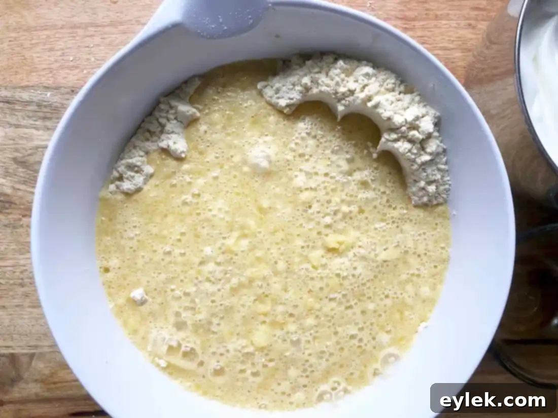 Gluten-Free (Or Not) Classic Belgian Waffles: Close-up of waffle batter with small butter pieces.