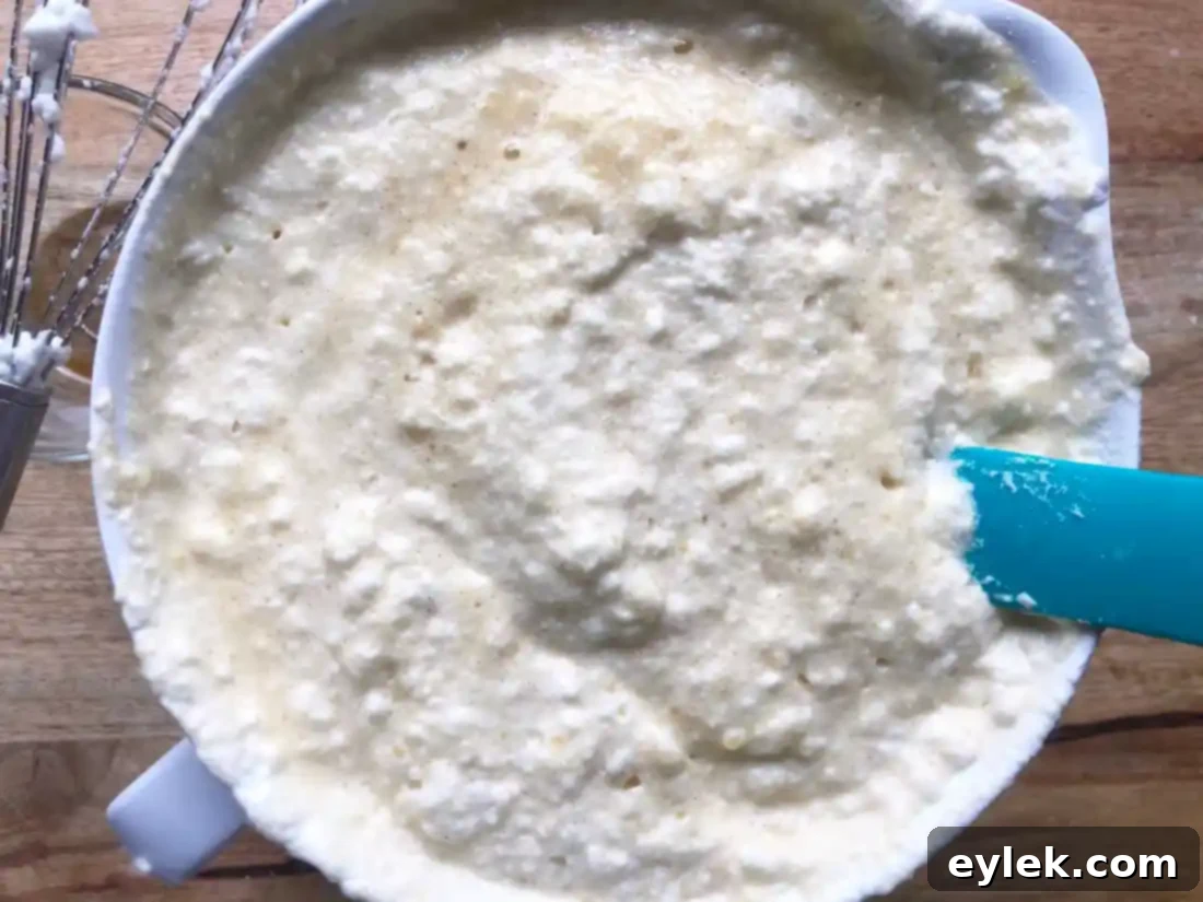 Gluten-Free (Or Not) Classic Belgian Waffles: Waffle batter being folded gently.