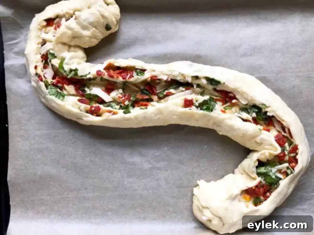 pane bianco dough cut and twisted into an S shape