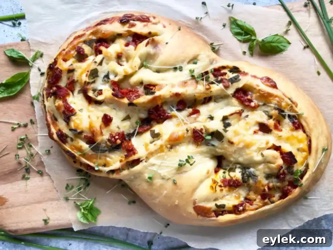 freshly baked pane bianco with sun-dried tomatoes on a cooling rack
