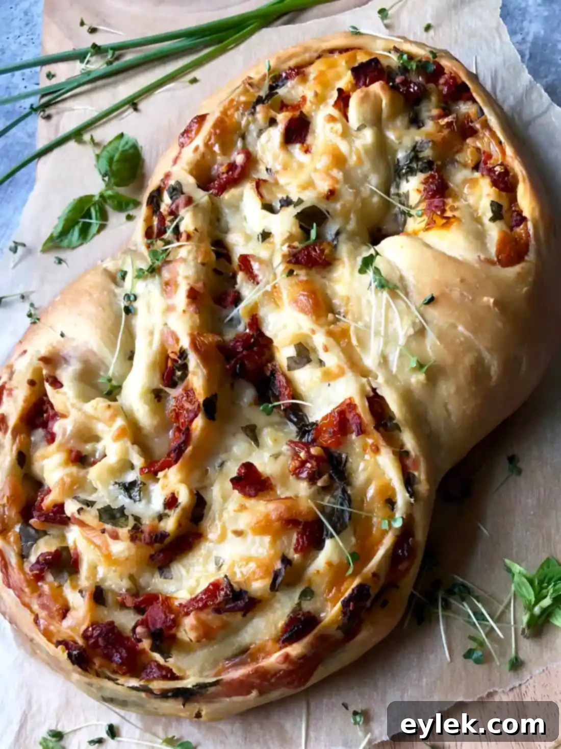 vertical shot of a single slice of pane bianco with sun-dried tomatoes