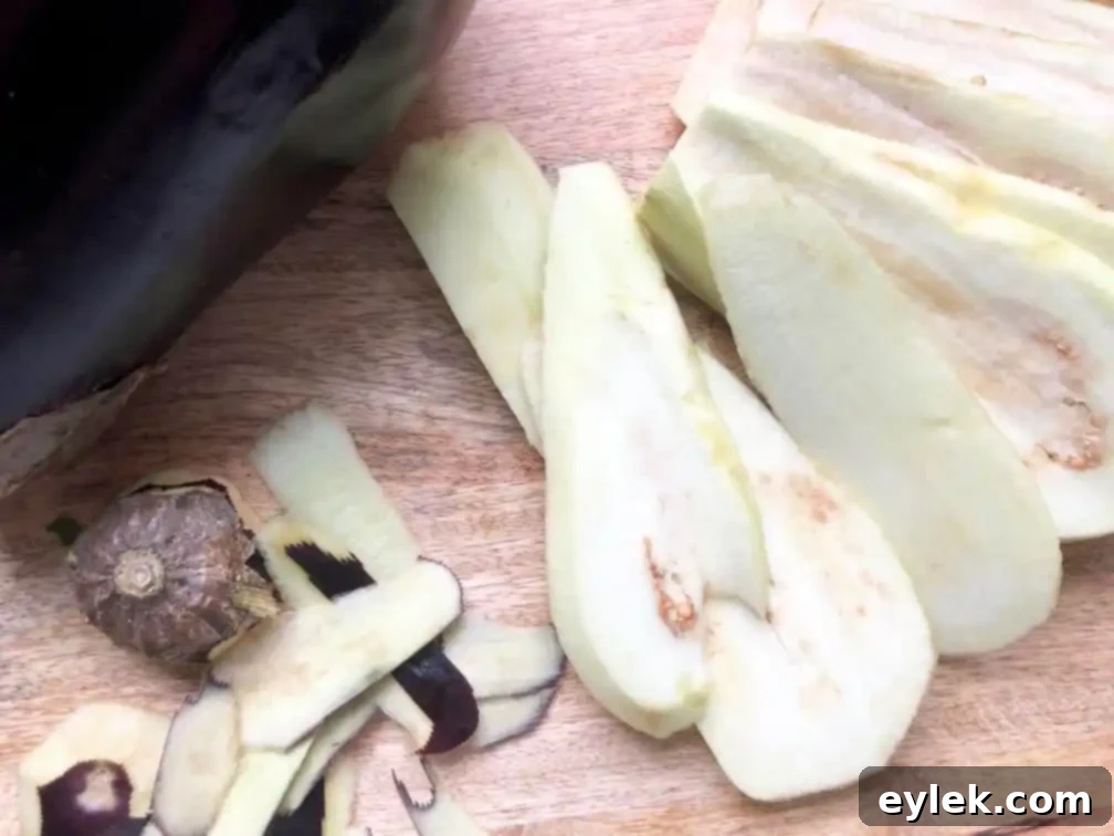 Eggplant slices pre-salted and drying, ready for coating