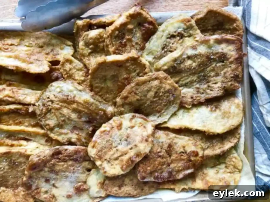 Frying eggplant slices to golden brown perfection