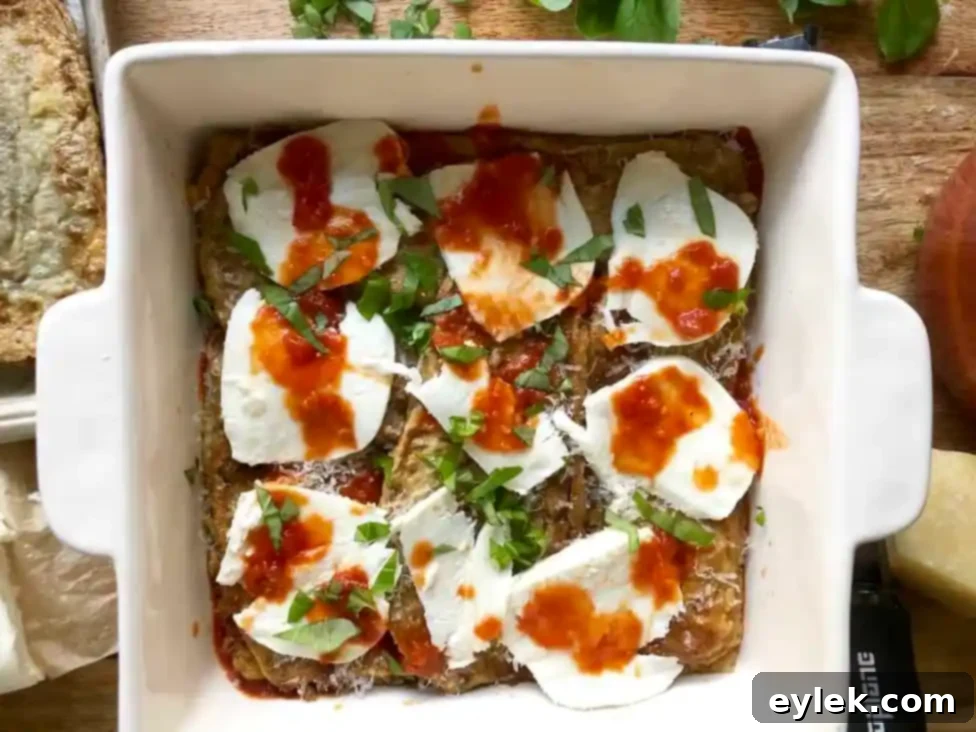 Adding a layer of fried eggplant slices to the baking dish
