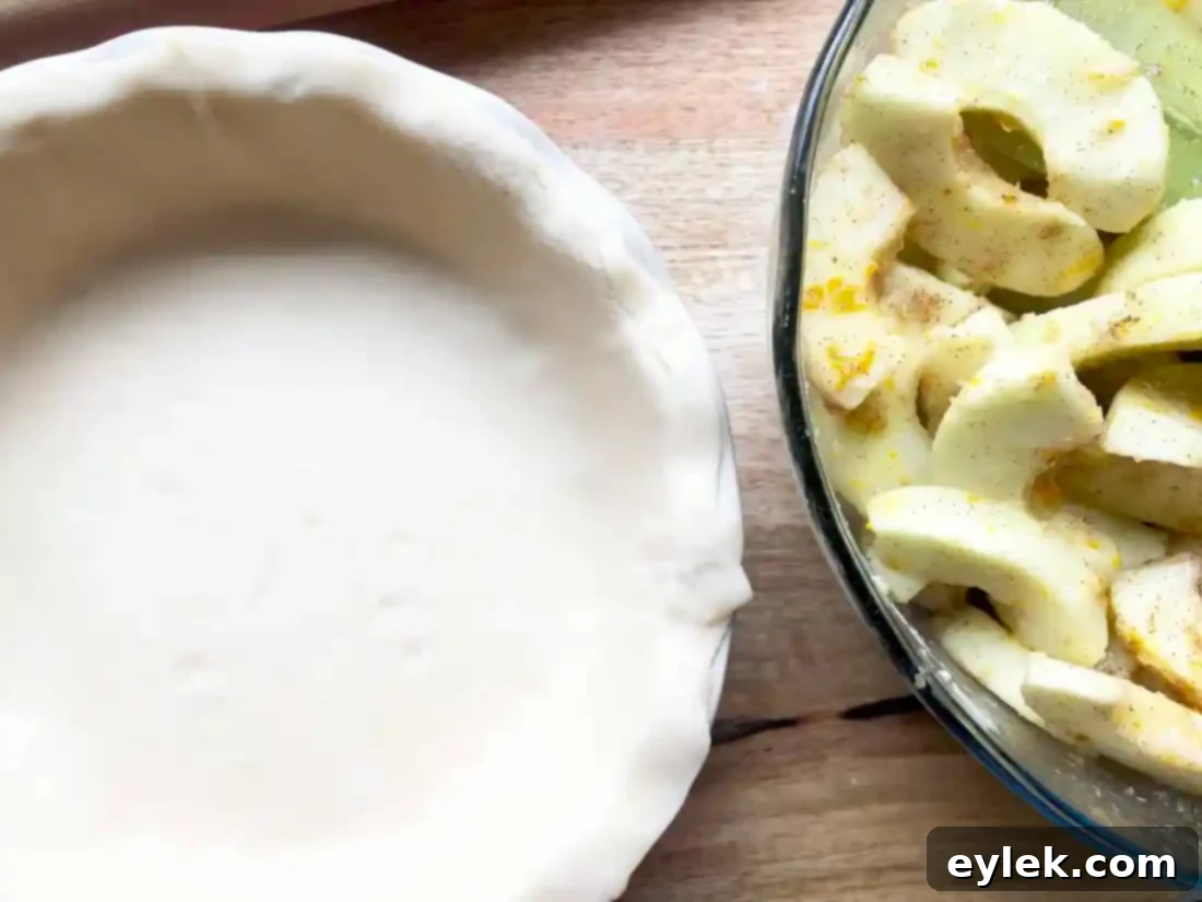 Crimping the edges of a Deep Dish Apple Pie for a rustic seal