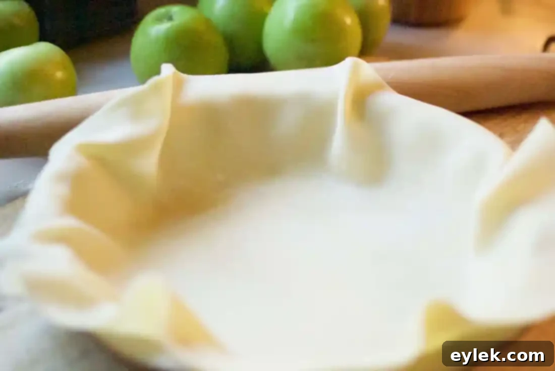 Prepared apple filling in a bowl for Deep Dish Apple Pie