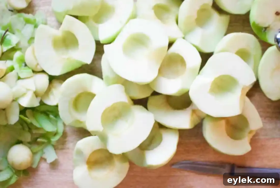 Apple slices mixed with spices and citrus zest for pie filling