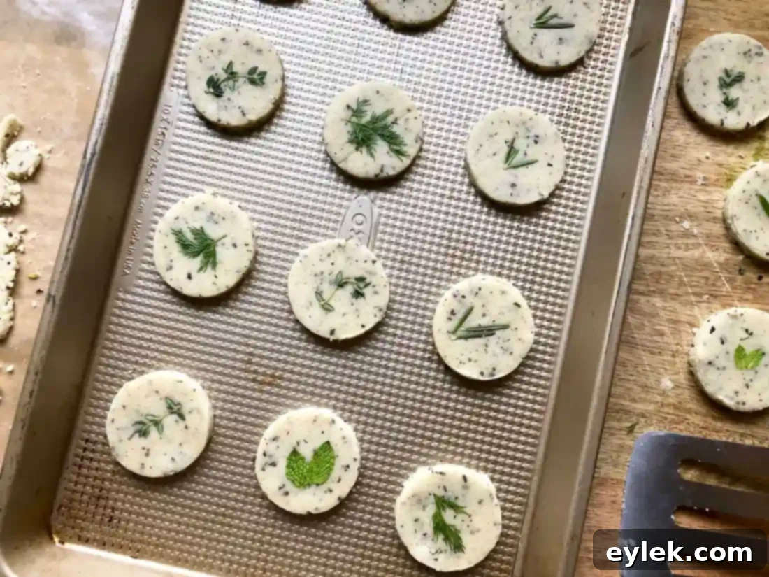 Rosemary Parmesan Cracker Rounds on Baking Sheet