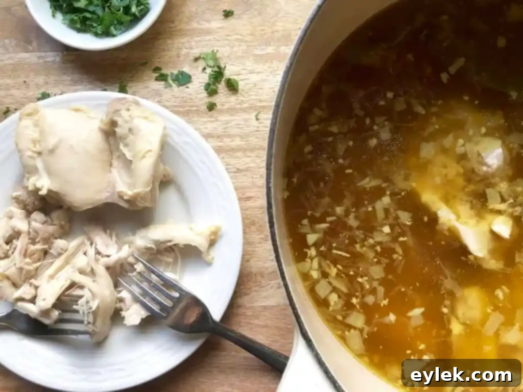 shredded chicken and broth simmering
