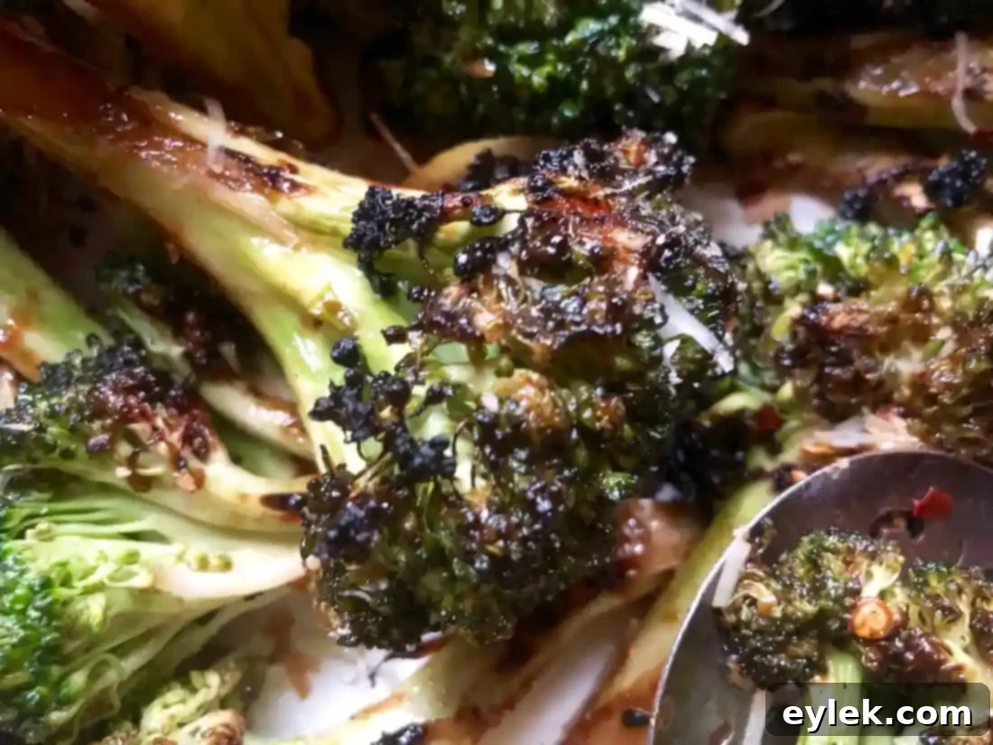 Smoky Marinated Broccoli Spears 13 Grilled broccoli spears and lemon wedges on a cutting board