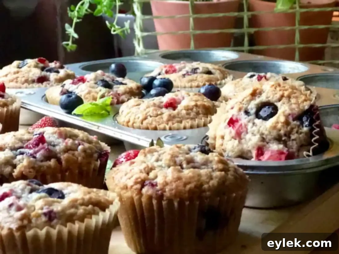 Triple Berry Muffins Gluten Free or Classic 13 A stack of golden, freshly baked gluten-free triple berry muffins