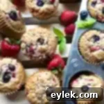 Triple Berry Muffins Gluten Free or Classic 14 Close-up of a perfectly baked triple berry muffin with a delicious crunchy top