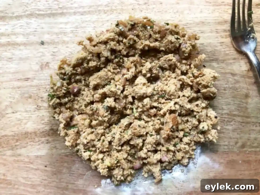 Pork burger patty with an indentation
