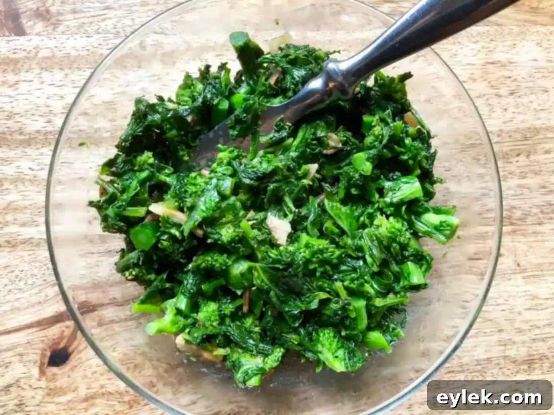 Sautéed broccoli rabe transferred to a serving bowl
