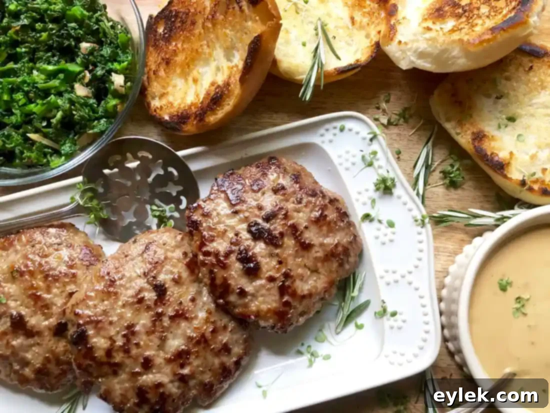 Pork burger patties cooking in a hot skillet