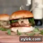 Savory Italian Pork Burgers with Sautéed Broccoli Rabe 25 A perfectly assembled Italian pork burger with broccoli rabe on a bun