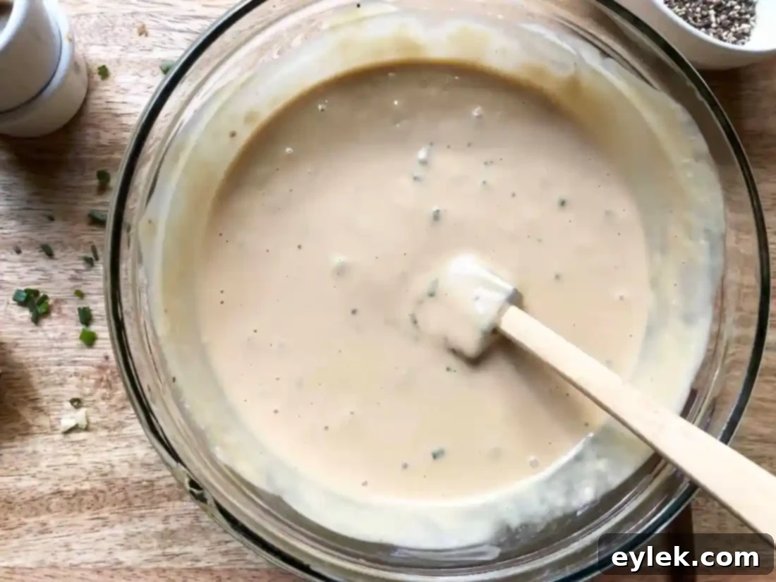 Ingredients for the pub burger sauce being whisked in a bowl