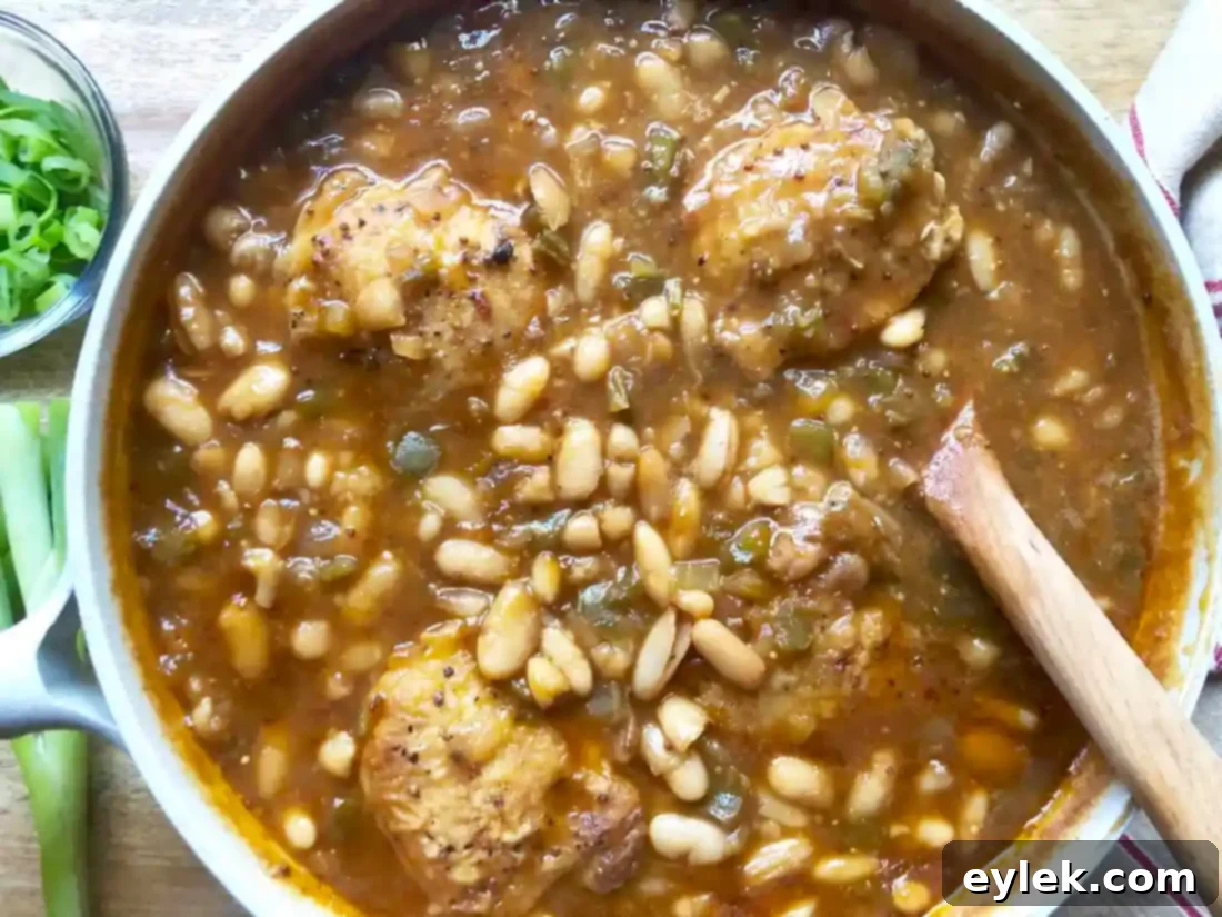 close up of chicken thighs and barbecue beans
