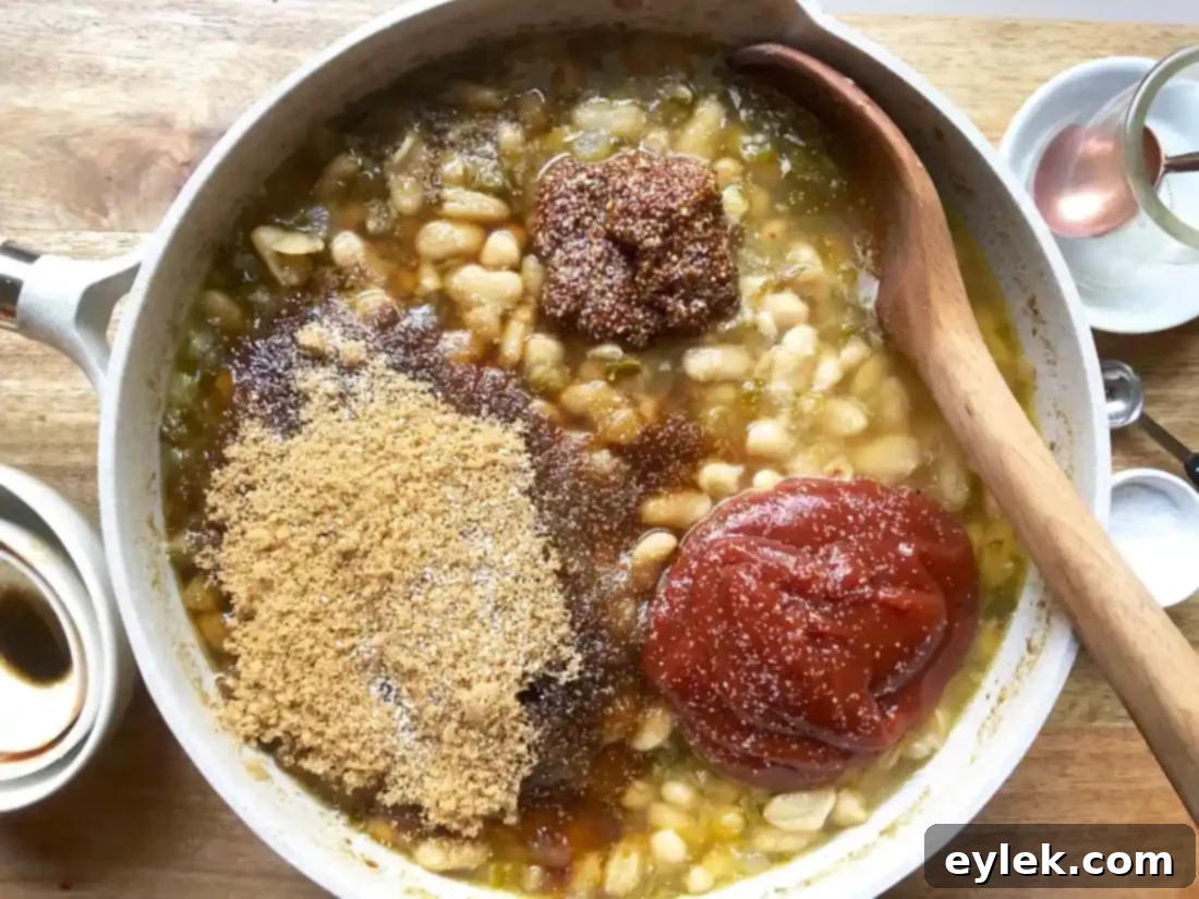 adding barbecue sauce ingredients to beans