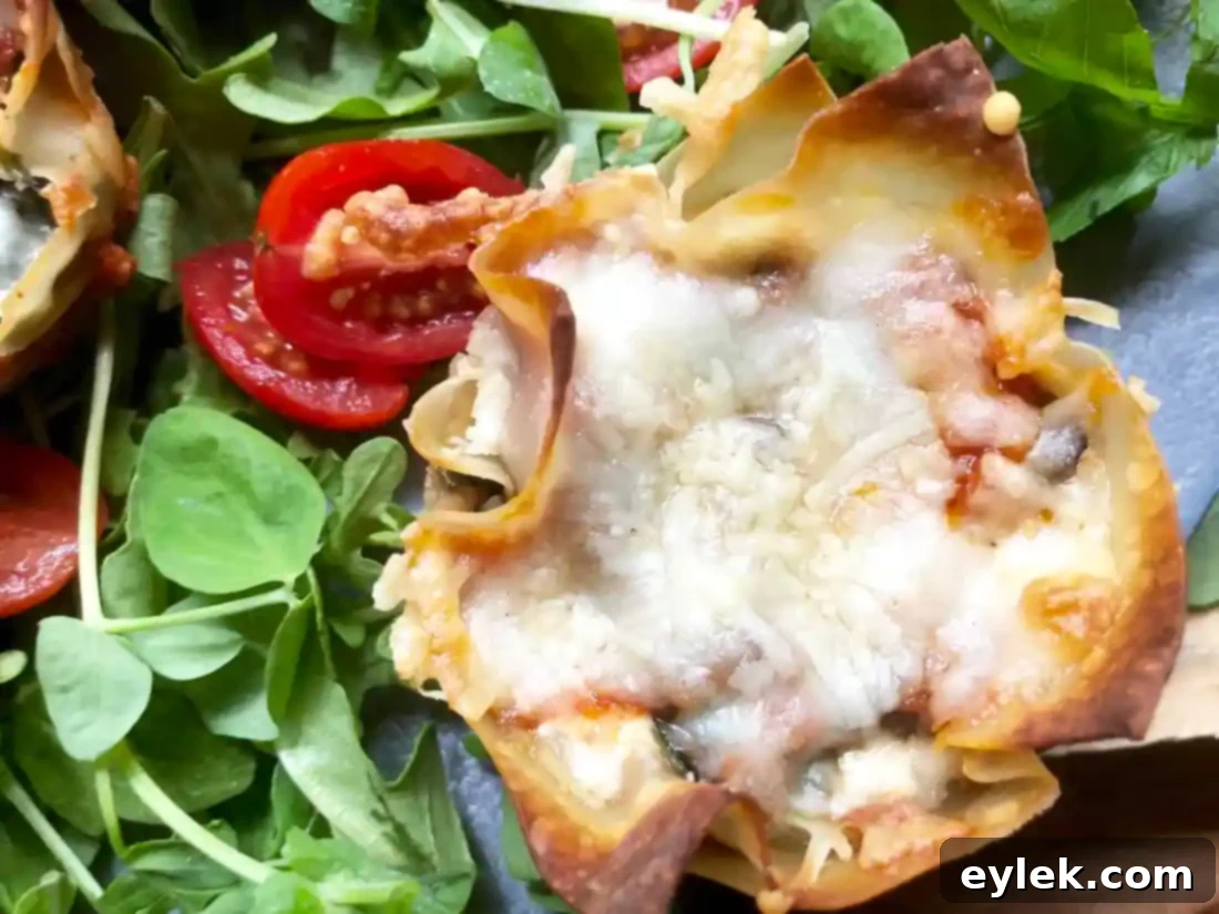 A dish of Quick & Easy Veggie Lasagna Cups garnished with fresh basil, ready to be served.