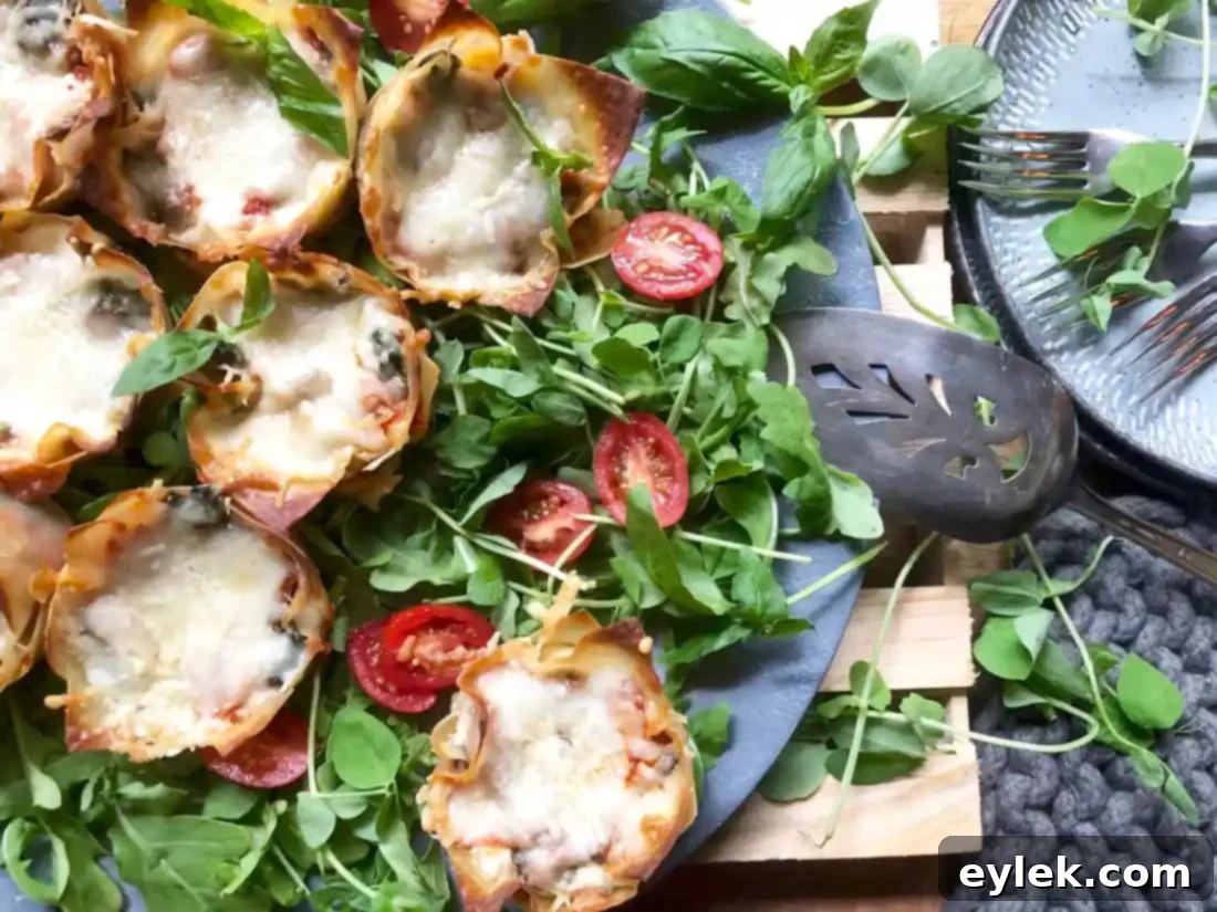 Fresh basil leaves topping the golden-brown Quick & Easy Veggie Lasagna Cups.
