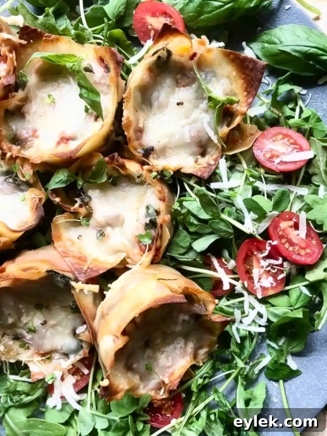 A beautifully presented stack of Quick & Easy Veggie Lasagna Cups, garnished with fresh basil.