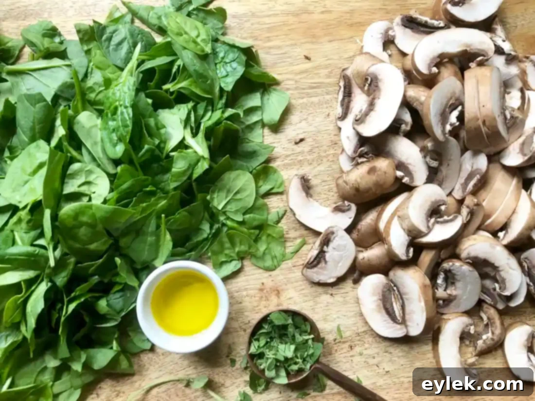 Sautéing mushrooms and spinach for the veggie lasagna cup filling.