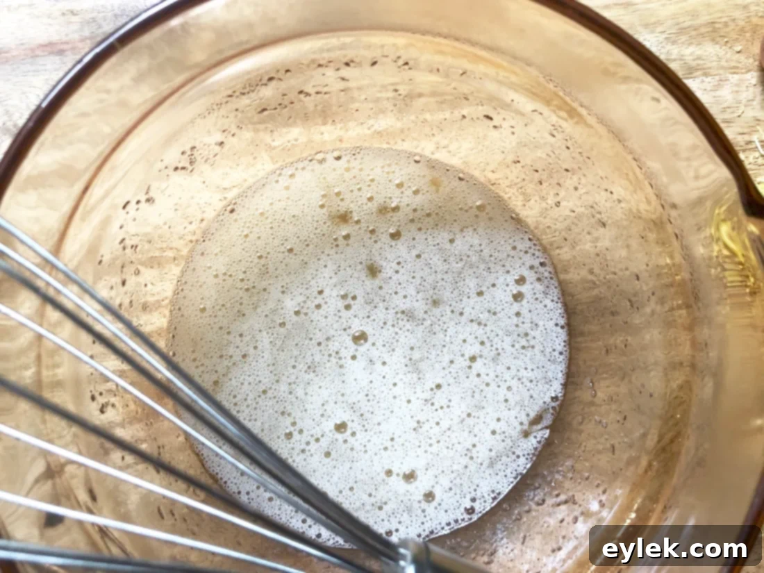 Egg whites, sugar, and cream of tartar mixture thickening