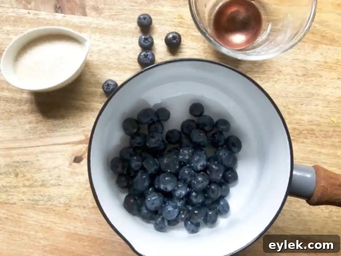 Blueberries simmering on the stovetop for the sauce