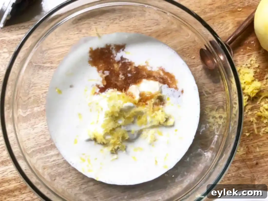 Mixing lemon zest, yogurt, and other ingredients for the mousse base