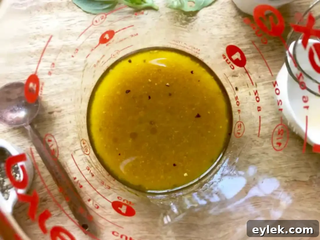 Whisking the homemade balsamic vinaigrette