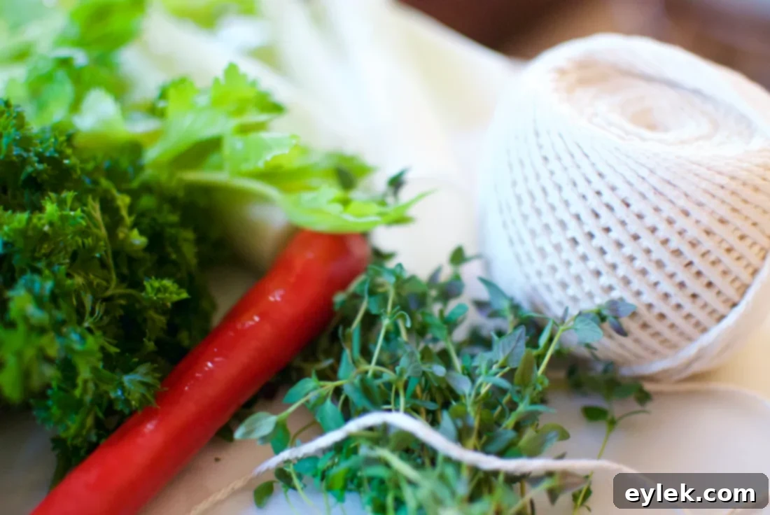 Fresh herbs tied with kitchen string for a bouquet garni