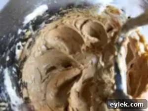 Adding flour to shortbread dough