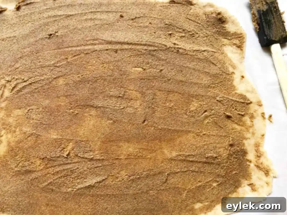 cinnamon swirl dough log being sliced