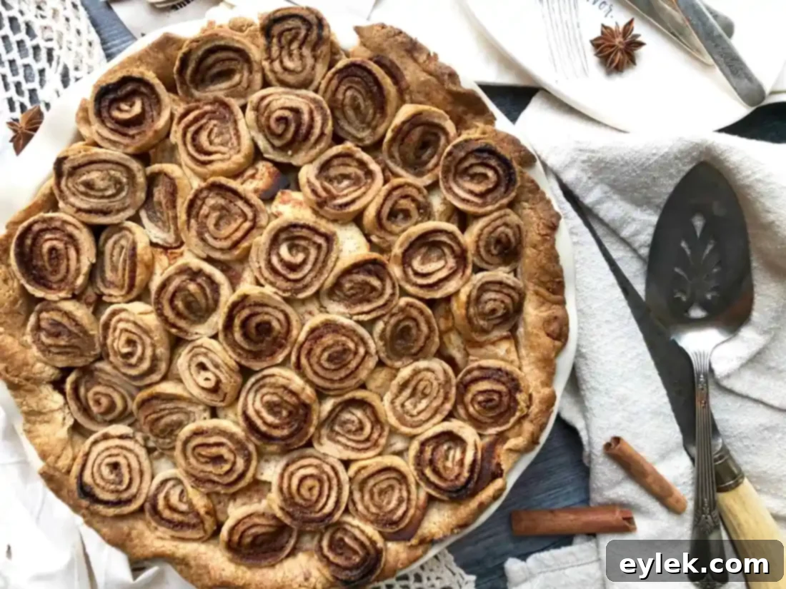 cinnamon swirl apple pie dusted with powdered sugar