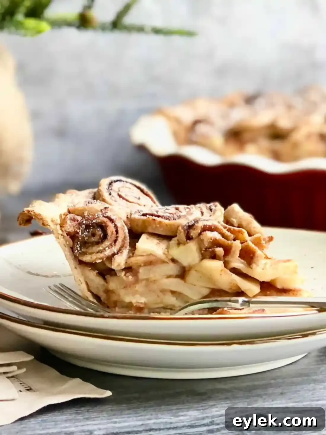Cinnamon Swirl Apple Pie with mini cinnamon buns as garnish