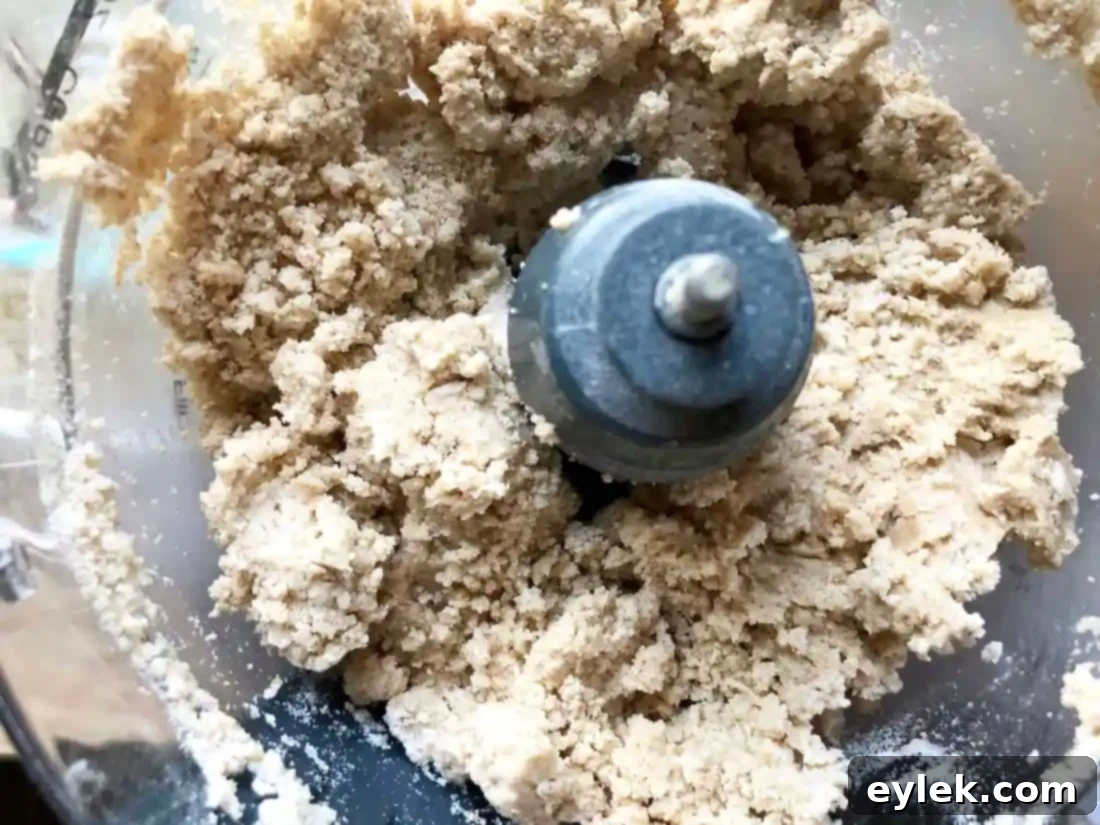 pie crust dough being kneaded