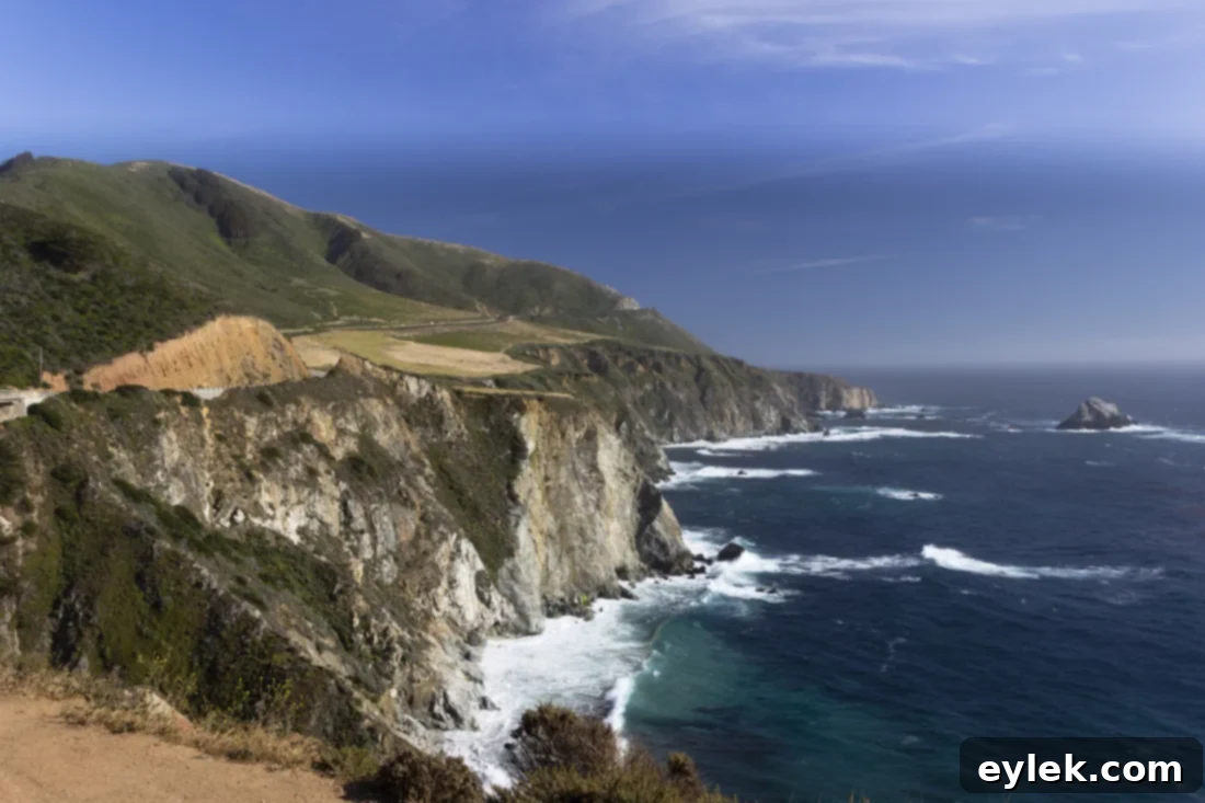 Scenic view of the Pacific Ocean from a coastal road, representing a California road trip.