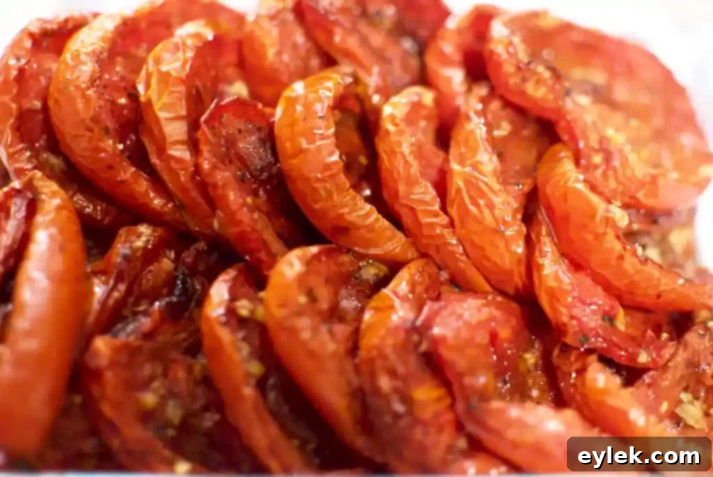 ina garten’s slow roasted tomatoes, stored in a glass container