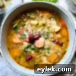 The Best Ever Soul-Satisfying Minestrone 12 A bowl of the ultimate hearty minestrone soup, freshly prepared and ready to serve.