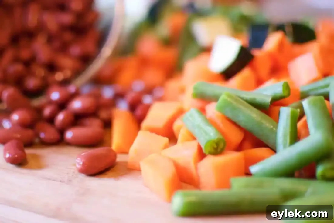 A large pot of hearty minestrone, freshly cooked and ready to be served, filled with colorful vegetables and beans.