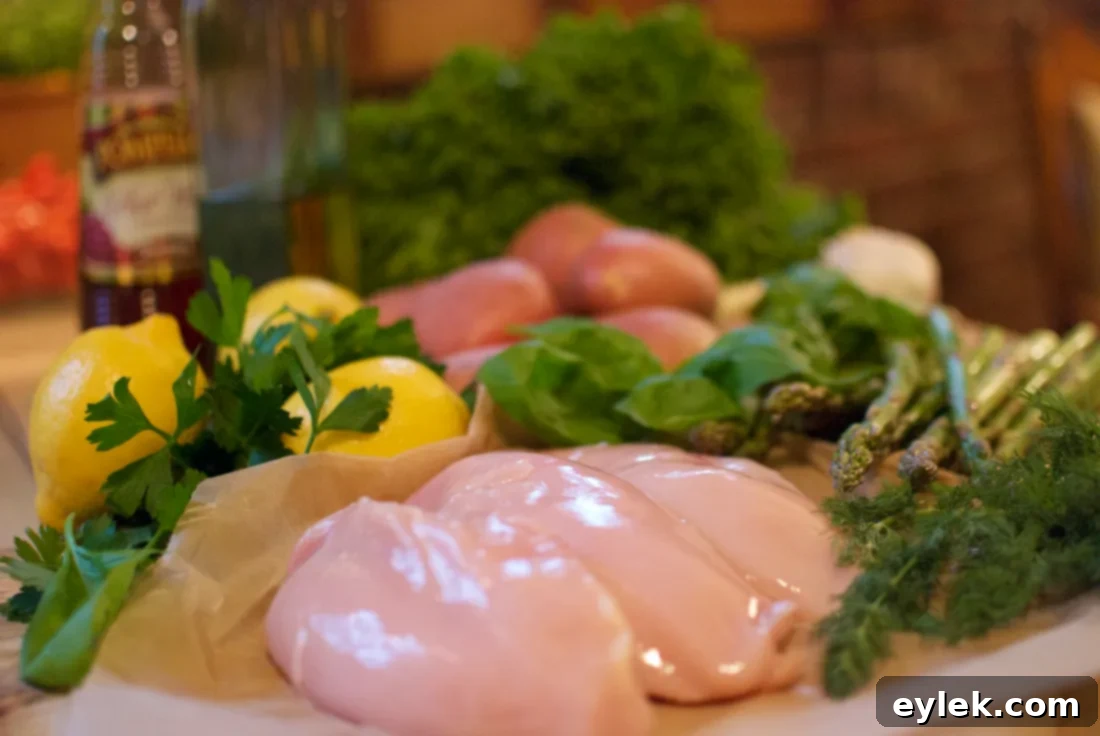 Delicious grilled chicken dinner with potatoes and asparagus arranged on a large serving platter